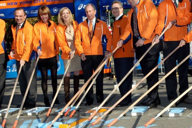 Mayor Bloomberg paints the gold finish line for the NYC Marathon yesterday